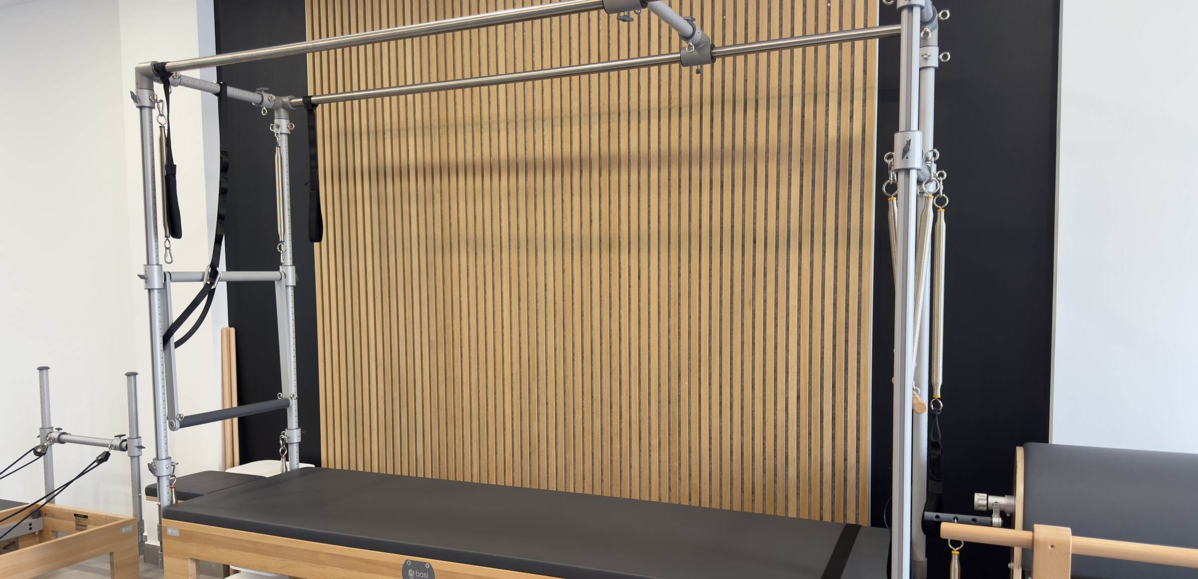 BASI Systems Cadillac in front of a wooden slat wall