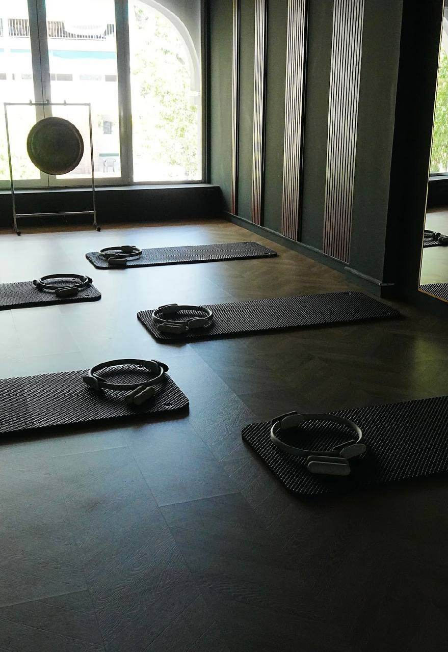 The upstairs Mat room with mats and Pilates rings set out