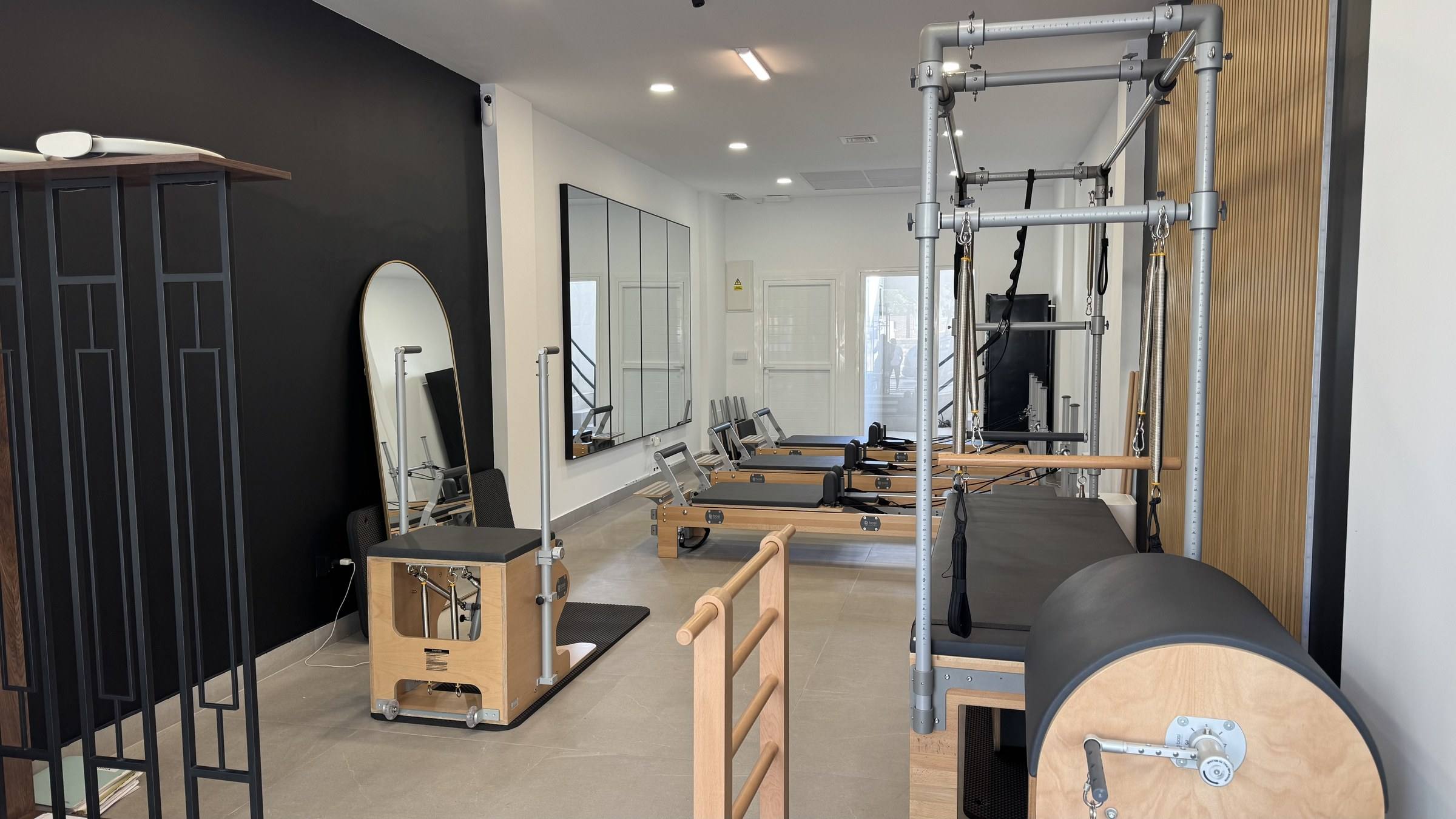 The main studio room with a BASI Systems Cadillac, Ladder Barrel, Wunda Chair and reformers